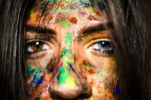 close up photo of woman with paint on face